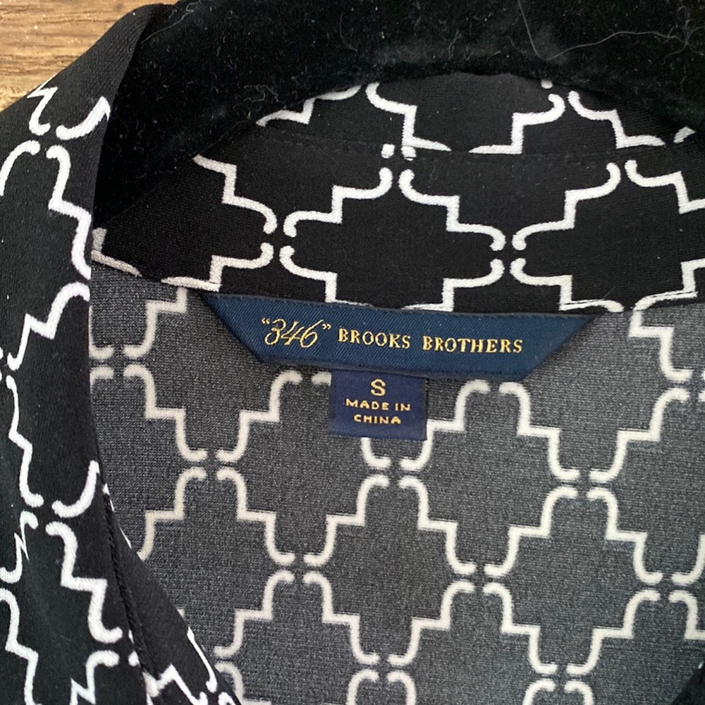 Long sleeve dress. Wrinkle resistant polyester and spandex.